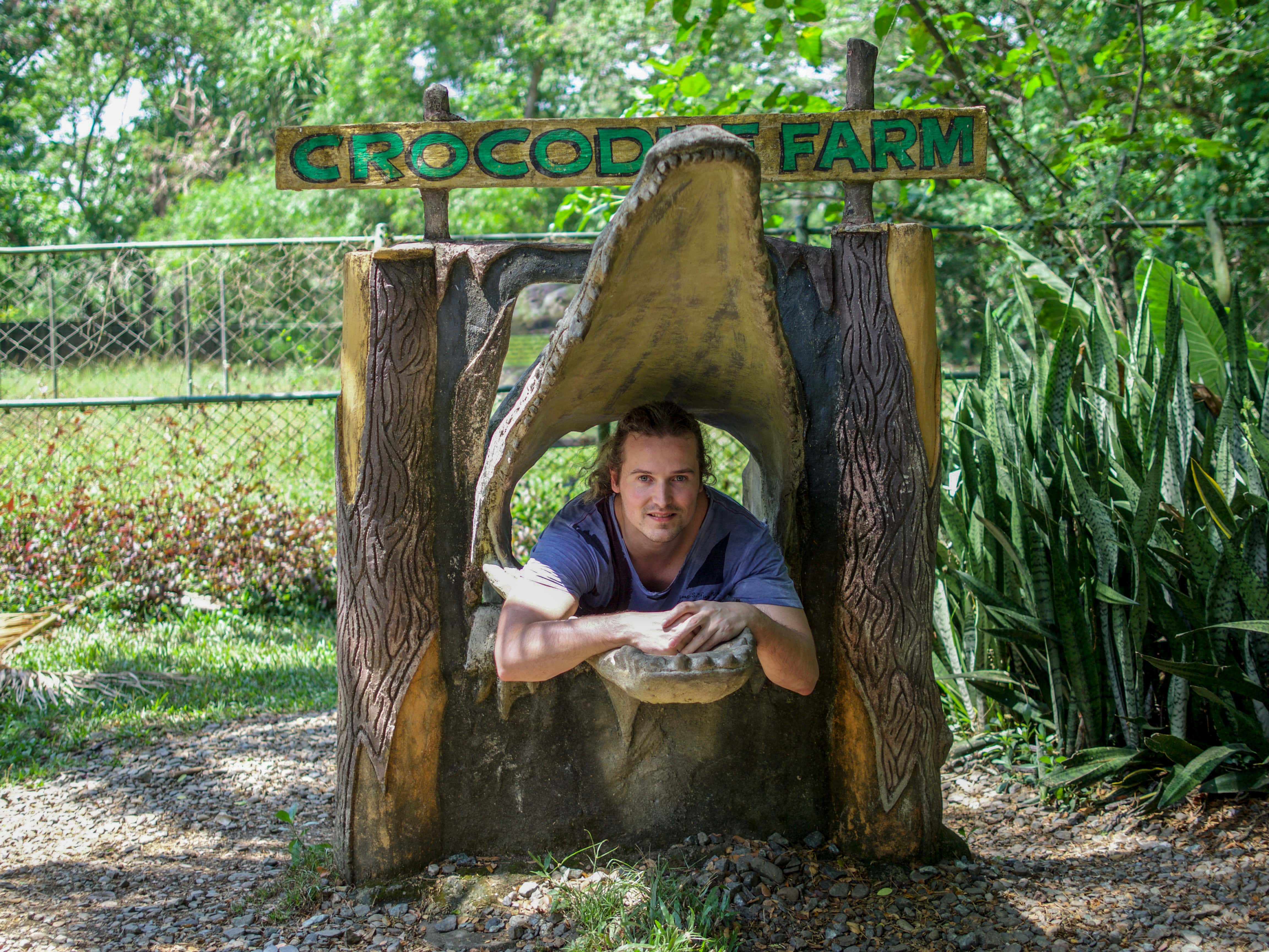 lenny posing inside crocodile mouth at Palawan Wildlife Rescue and Conservation Centre
